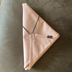 UMBRA Folding Hanging Travel Organizer. Light peach color.